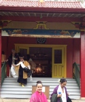 Tibetan Temple in Wood Valley, following 11/11/11 ceremony. Kumu (~Teacher~) left ,in black & gold, coming down stairs. Me (center- in pink blessing scarf) after being anointed & blessed as a "High Priestess," by Kumu with Pele's ashes & the sacred scarf . What a surreal experience & profound honor.